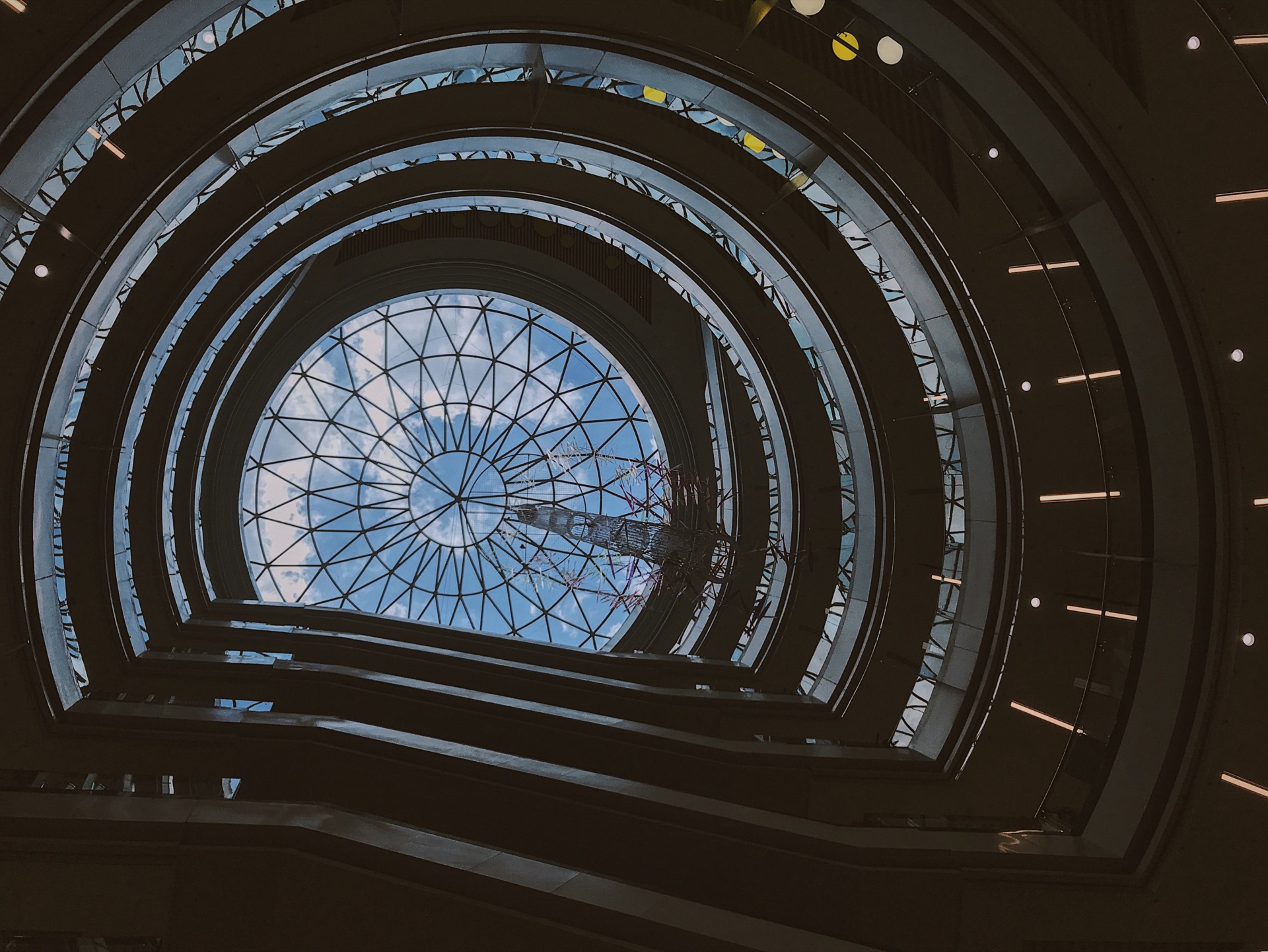 Looking up into a dark architectural dome